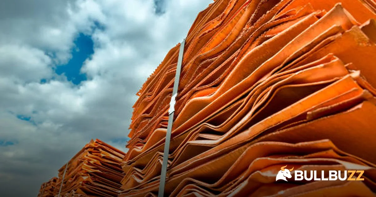 Stacked copper cathodes under a cloudy sky